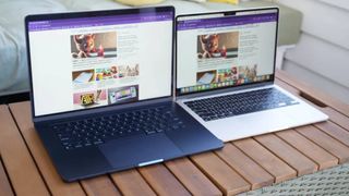 Two MacBook Air M3 laptops side by side on a wooden table